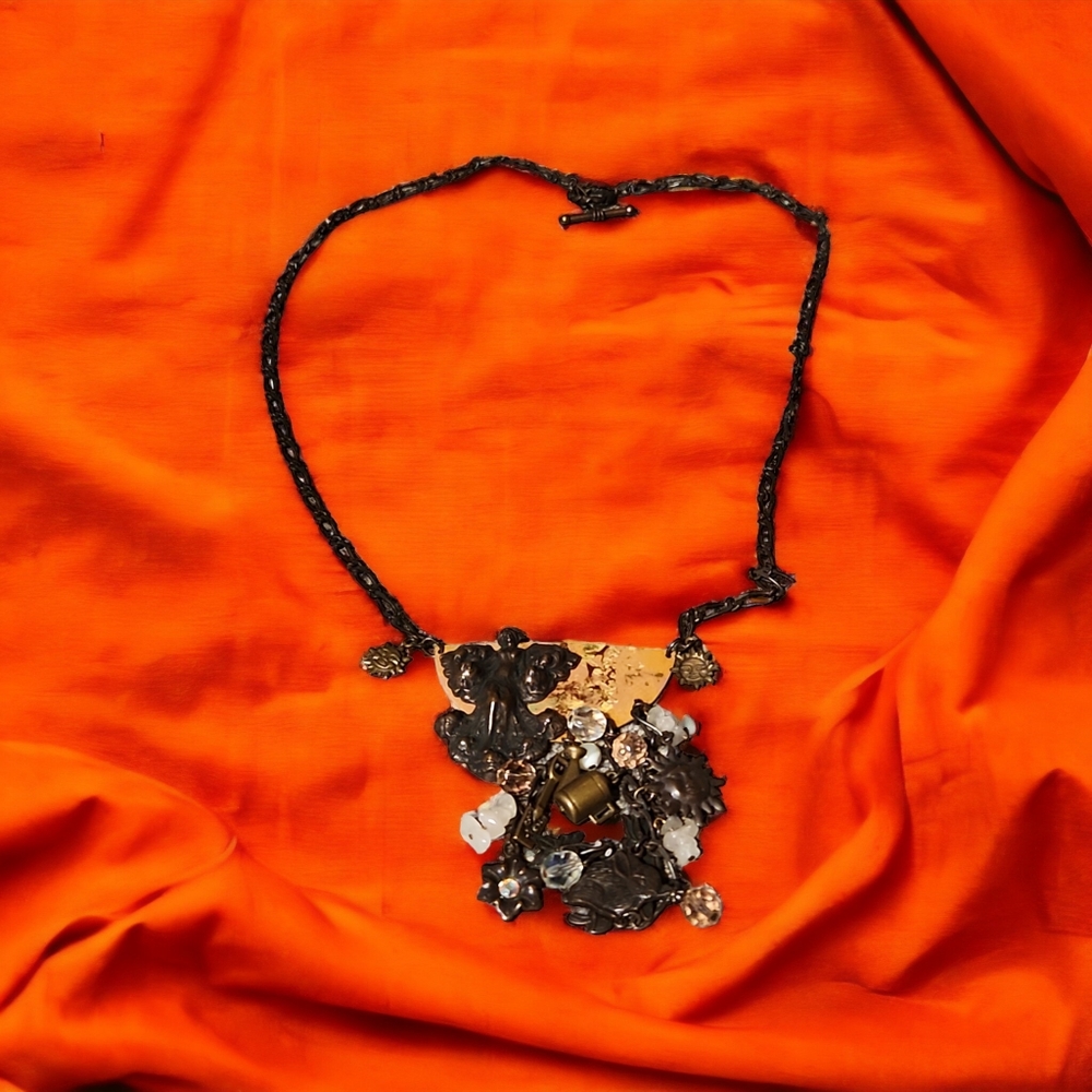 Unusual hand-crafted mixed medium necklace.